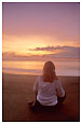 woman on beach at sunrise